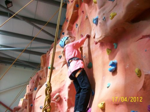 Aileen climbing the wall